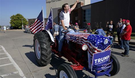 Trump campaigns before thousands in friendly blue-collar, eastern Iowa, touting trade, farm policy